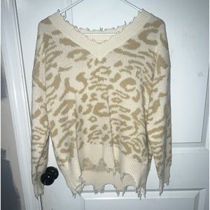 Leopard print “fringed” sweater